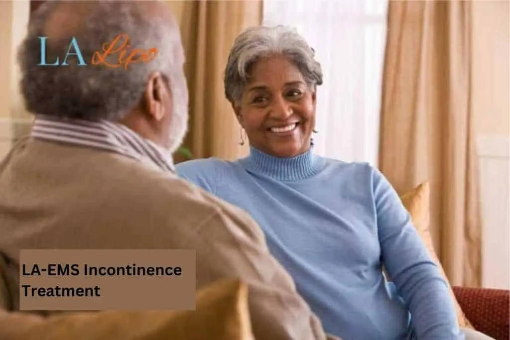 Couple sat smiling at each other - LA-EMS treatment Sydenham
